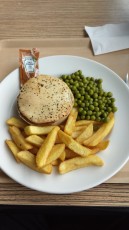 Steak & Ale pie with chips and green peas